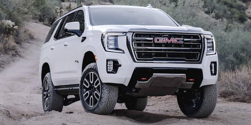 White GMC Yukon SUV off roading