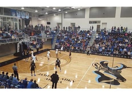 players are playing Basketball and audiance are chering them